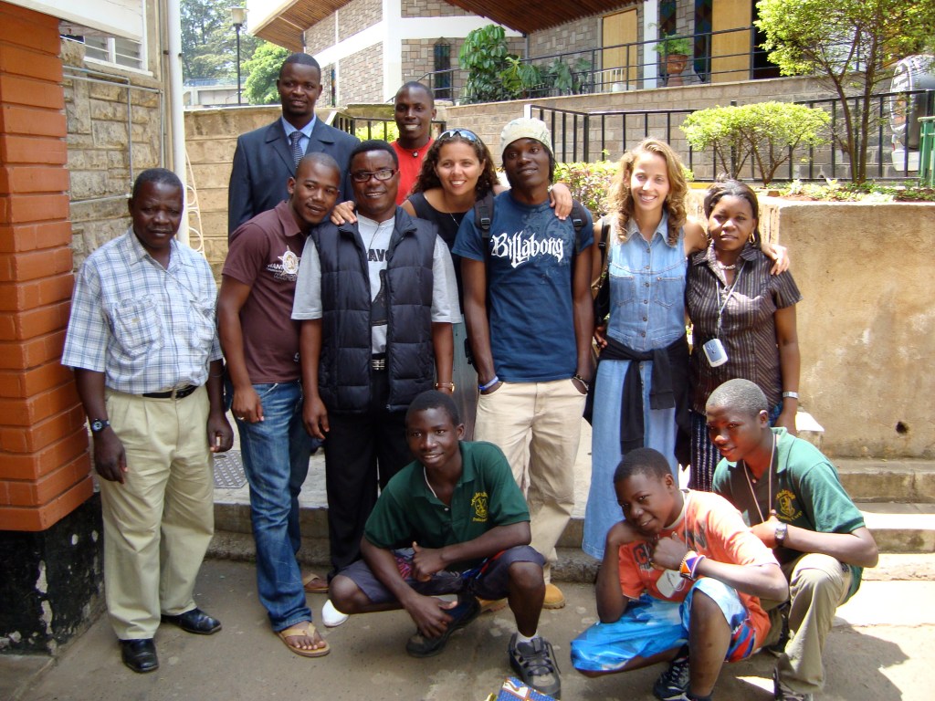 author in Africa surrounded by local pastors and children